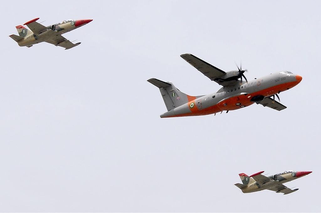 A Nigerian Air Force ATR-42-500MP Surveyor aircraft flying with two Alpha Jets during an archival demonstration.